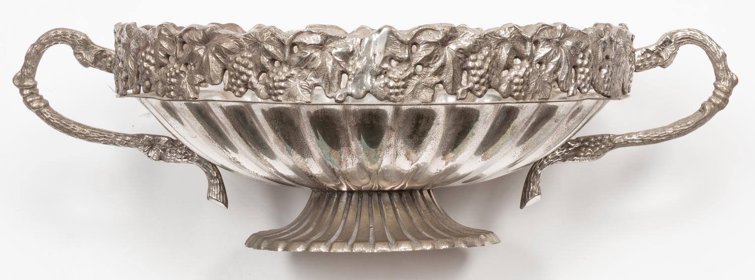 A Set of Four Silver-Plate Handled Dishes