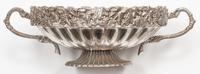 A Set of Four Silver-Plate Handled Dishes