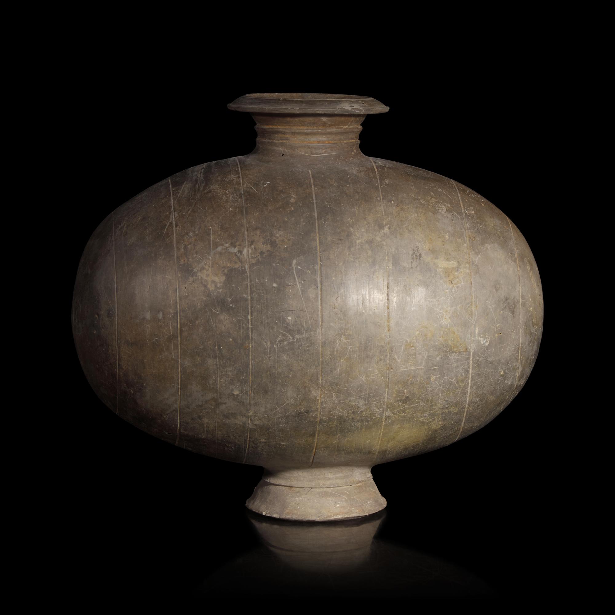 A Chinese Grey Pottery Cocoon Jar, Han Dynasty — 漢 灰陶繭形罐