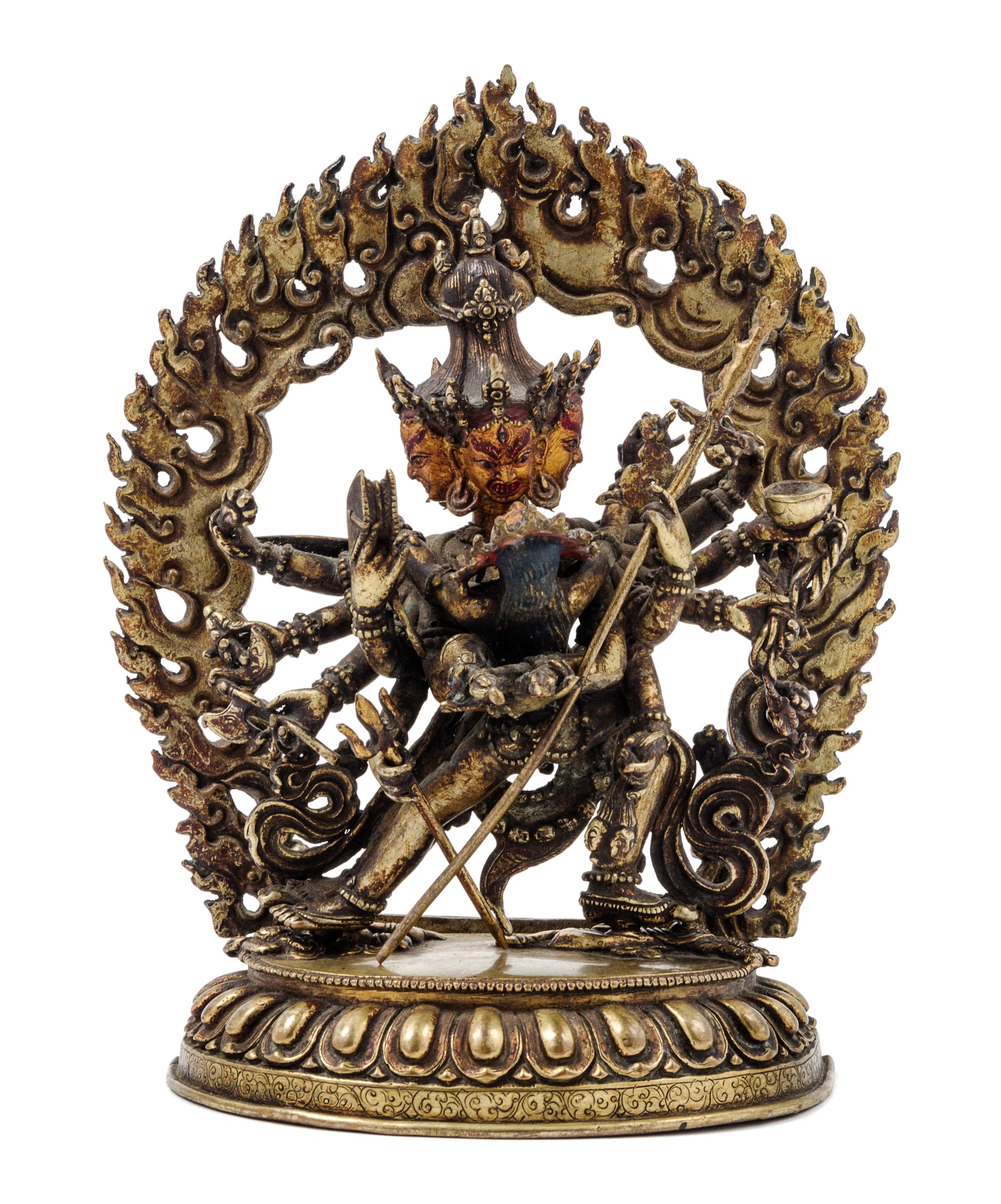 A Sino-Tibetan Gilt Bronze Figure of a Multi-Head Deity