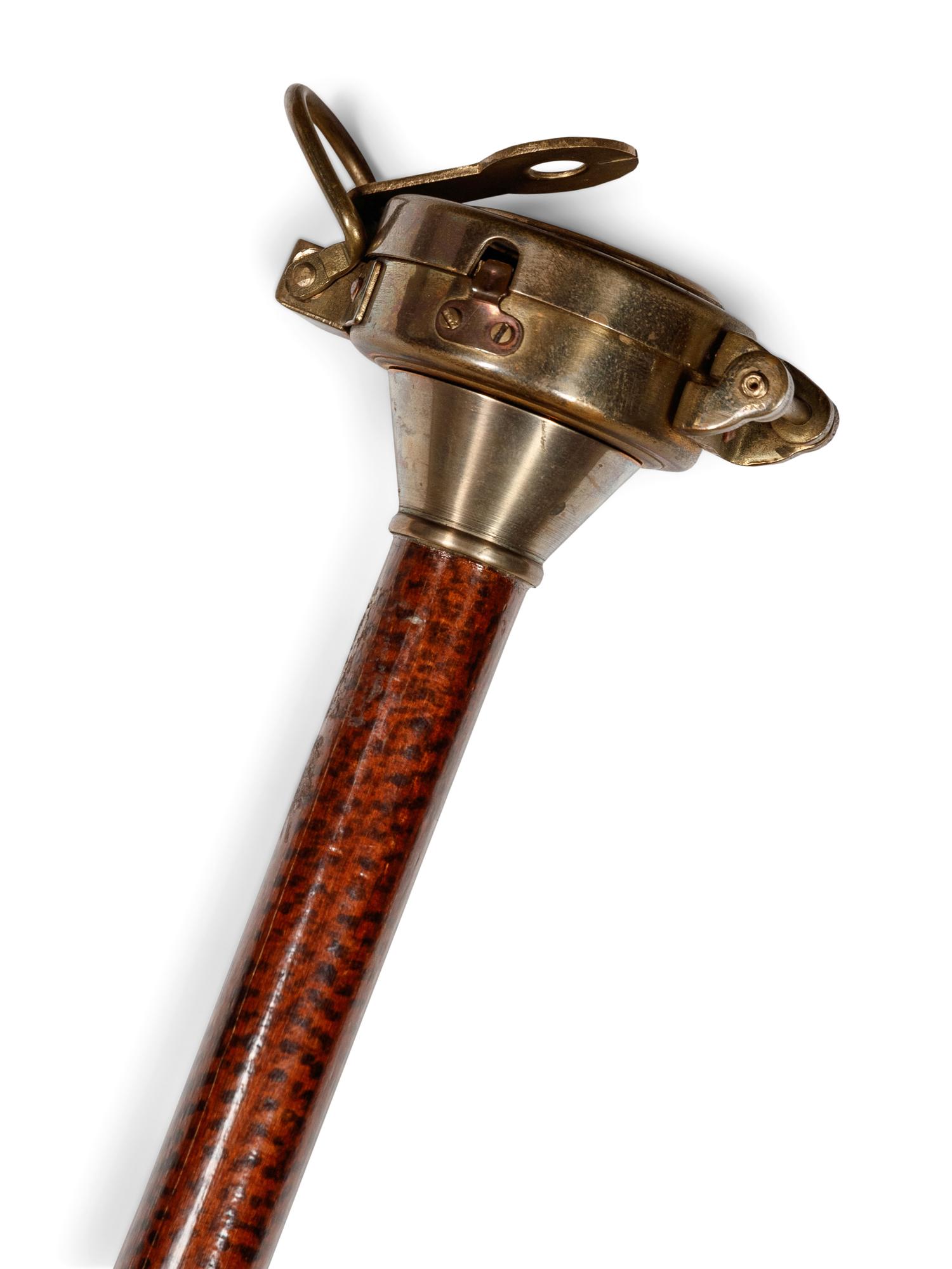 A Brass Mounted Simulated Snakewood Orienteer's 'System' Walking Stick