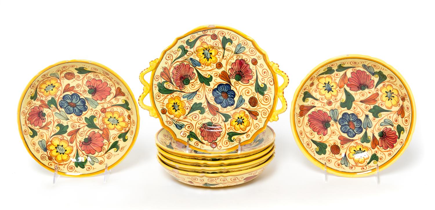 A Group of Seven Italian Faience Plates Width of handled plate 10 1/2 inches.