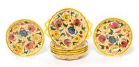 A Group of Seven Italian Faience Plates Width of handled plate 10 1/2 inches.