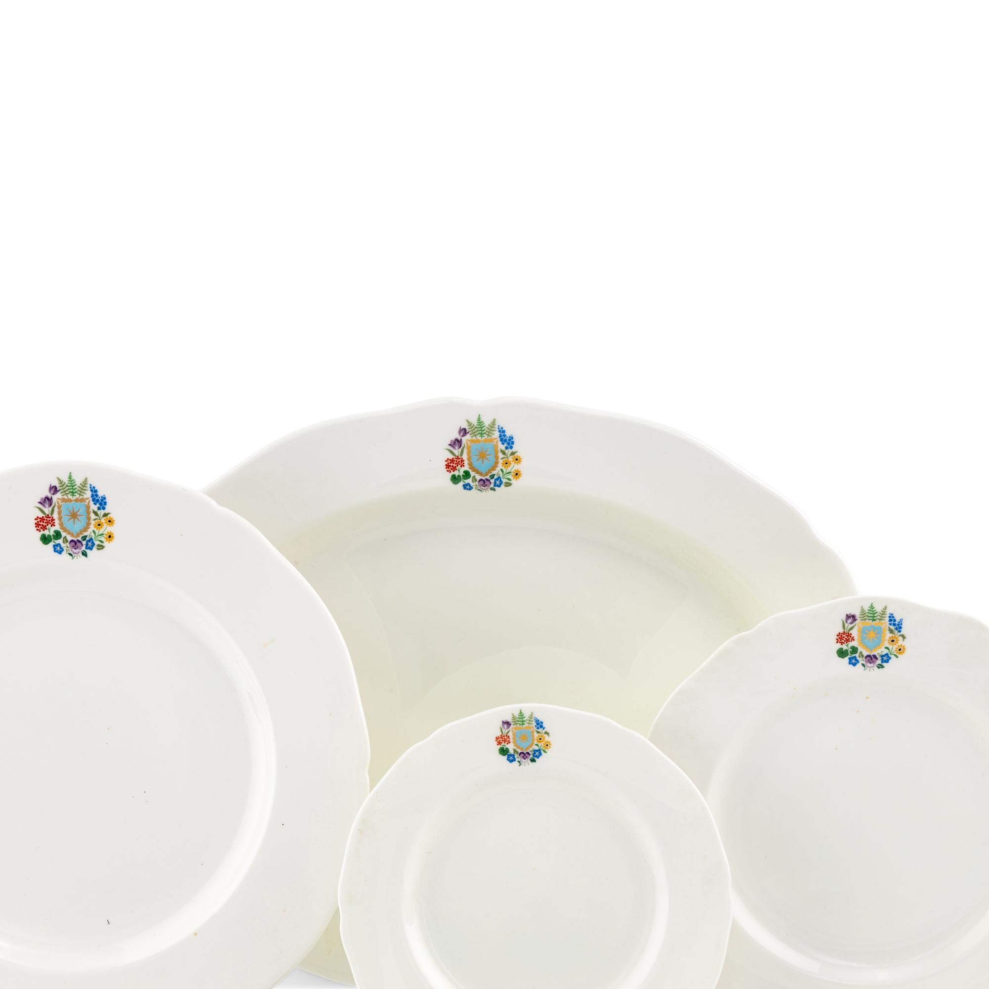 A Spode Porcelain Dinner Service for Fifteen in the Floral Armorial Pattern