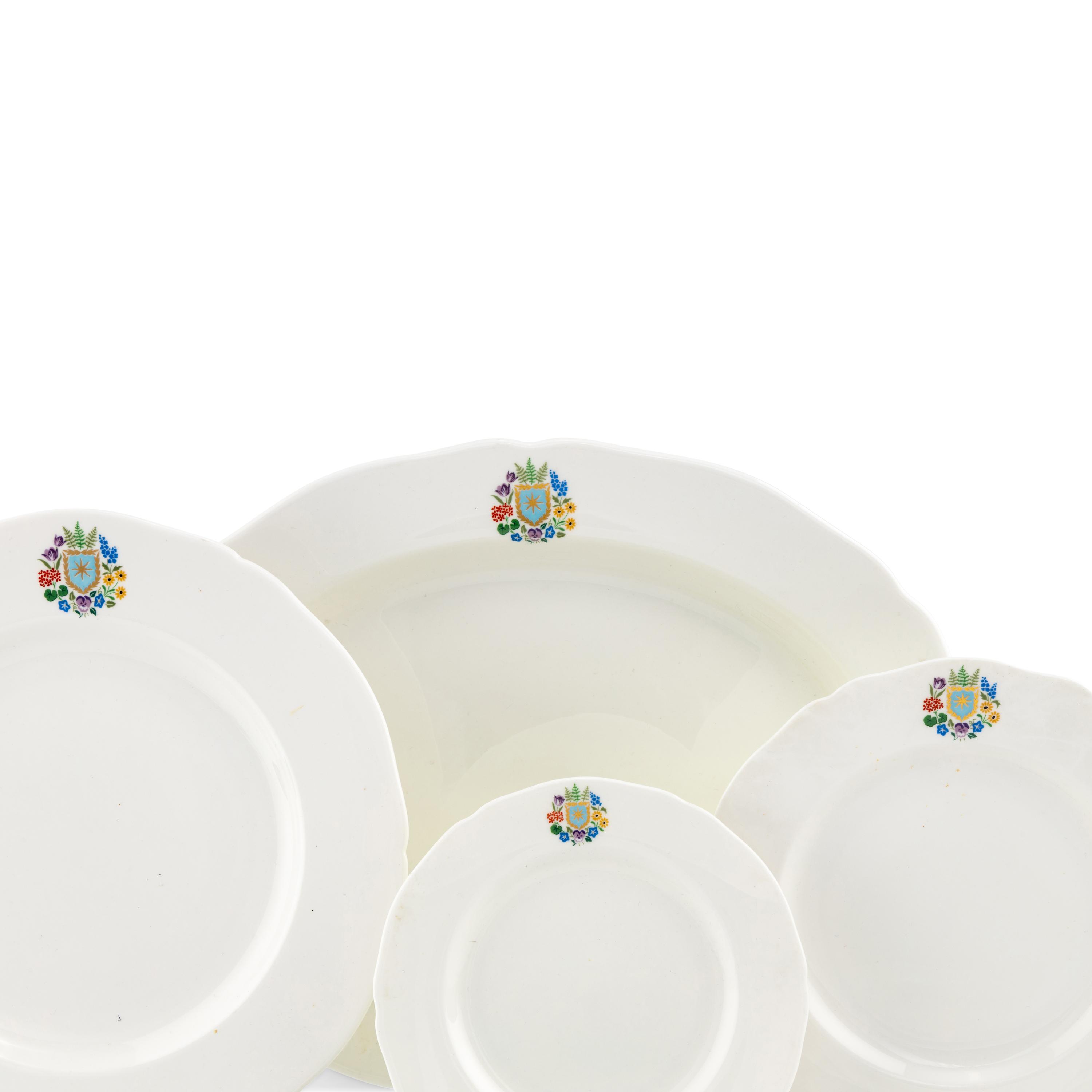 A Spode Porcelain Dinner Service for Fifteen in the Floral Armorial Pattern