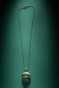 A Chontal Jade Maskette Pendant Necklace with Gold Chain