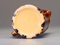 Fifteen Rockingham Pitchers and Plates