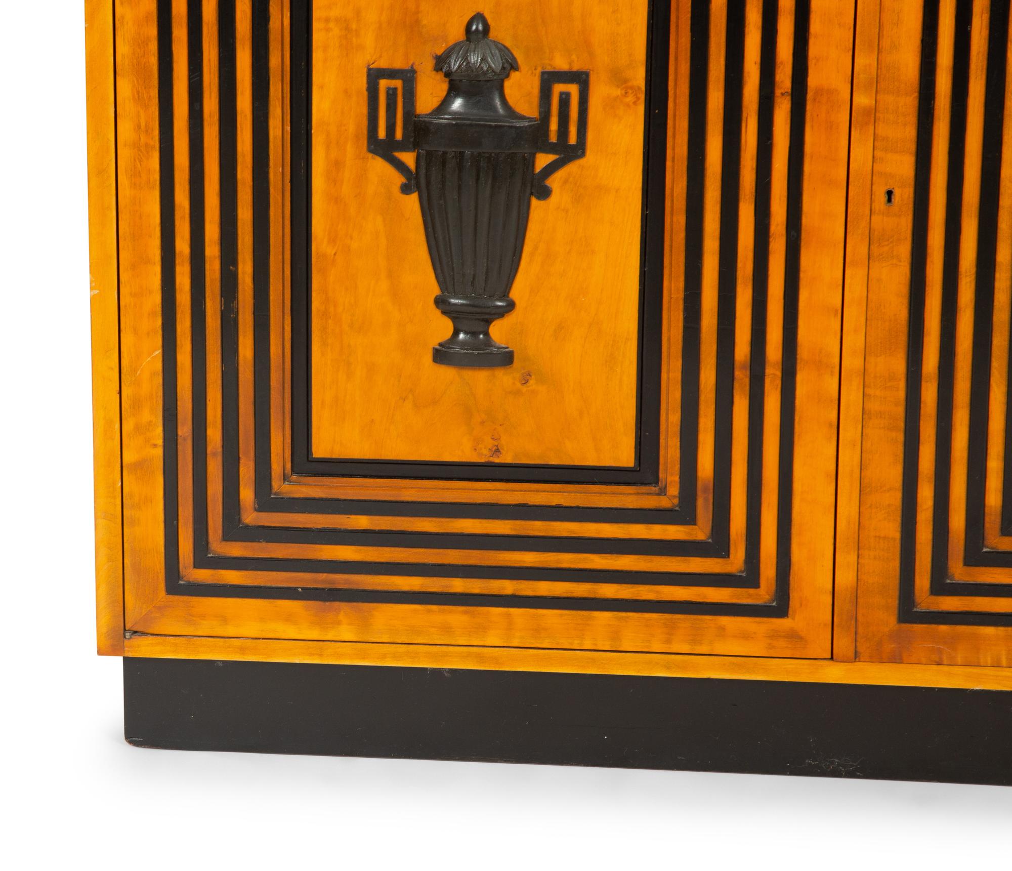 A Neoclassical Style Fruitwood and Parcel Ebonized Console Cabinet