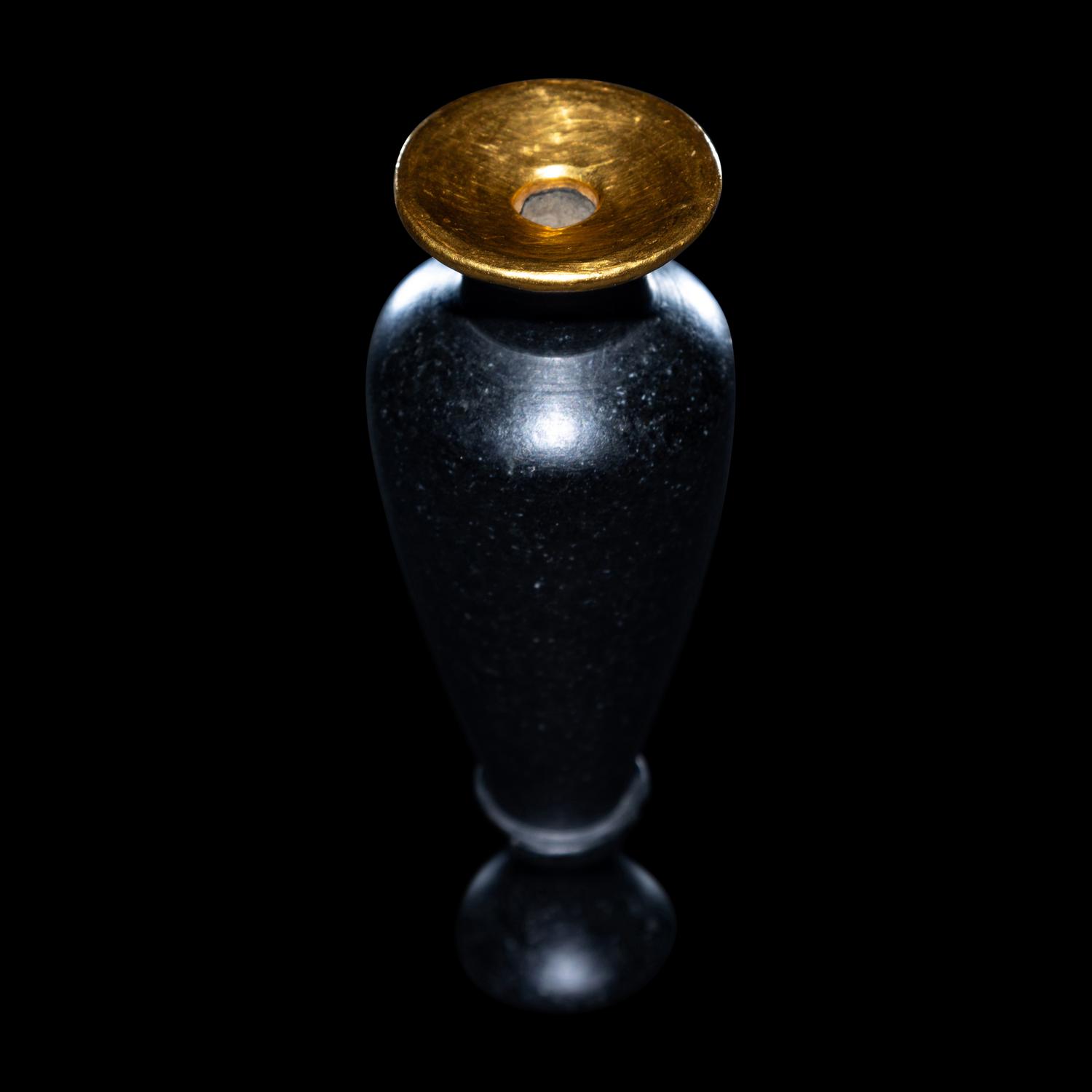 An Egyptian Obsidian and Gold Alabastron