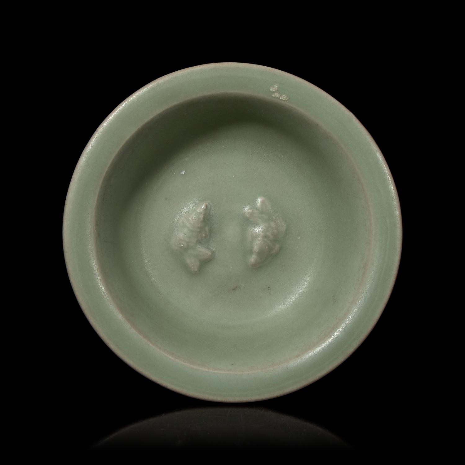 A Chinese Longquan Celadon Glazed 'Double Fish' Dish, Song-Yuan Dynasty 宋-元 龍泉窯雙魚碟