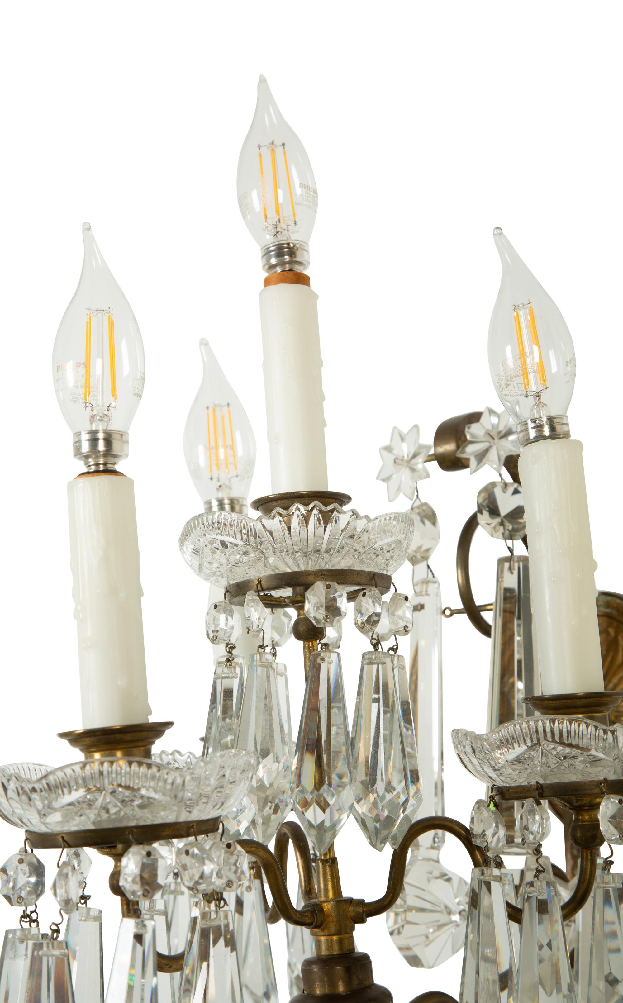 A Pair of Continental Gilt Metal and Cut Glass Four-Light Sconces