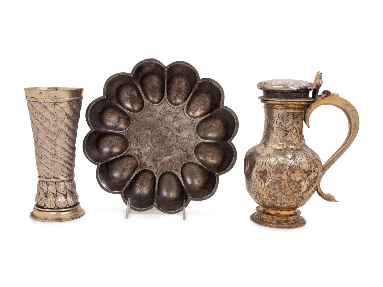 A Continental Silvered Metal Beaker, Covered Vessel and a Lobed Bowl