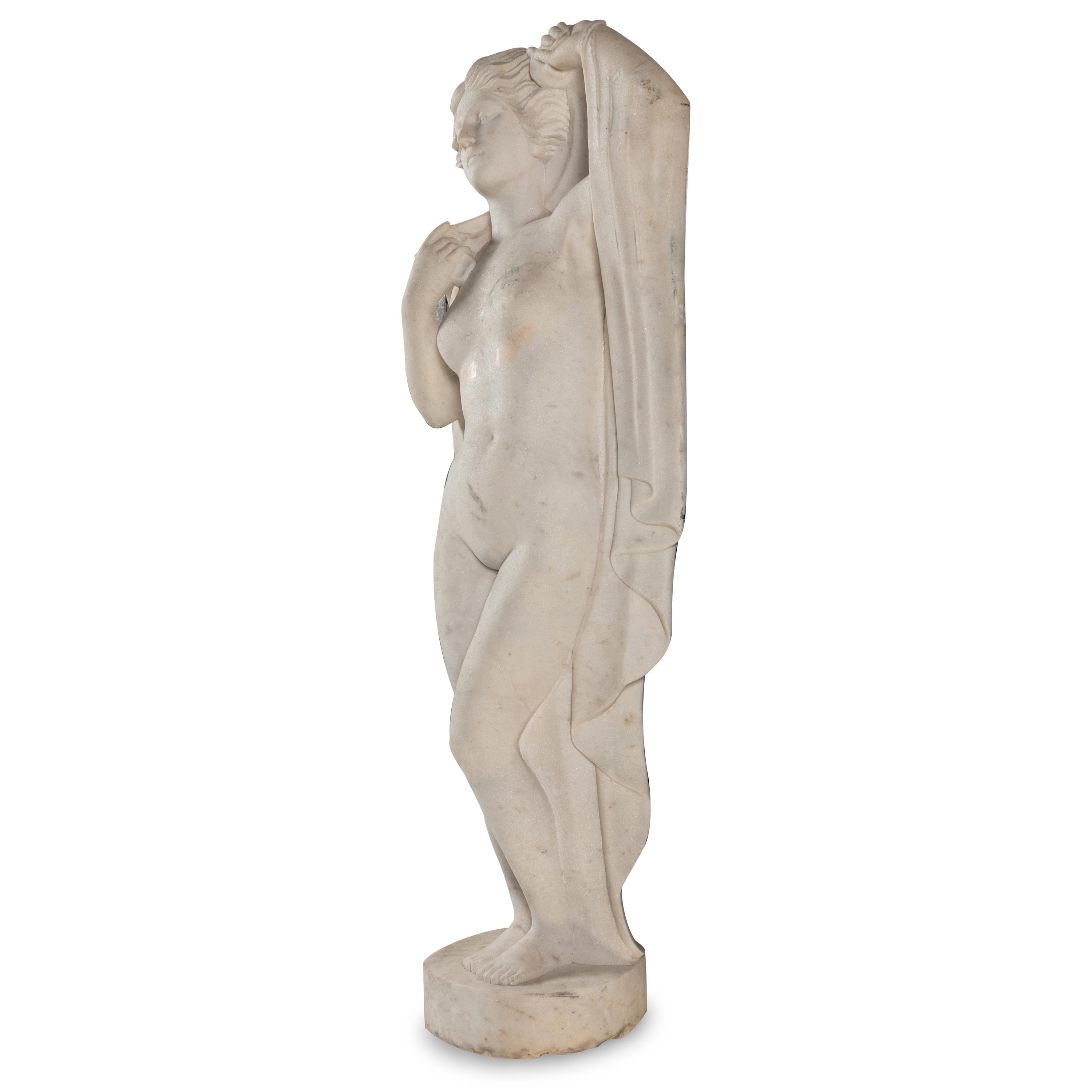 A Carved Marble Figure of a Maiden