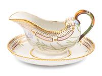 A Royal Copenhagen Flora Danica Porcelain Sauce Boat and Fixed Stand