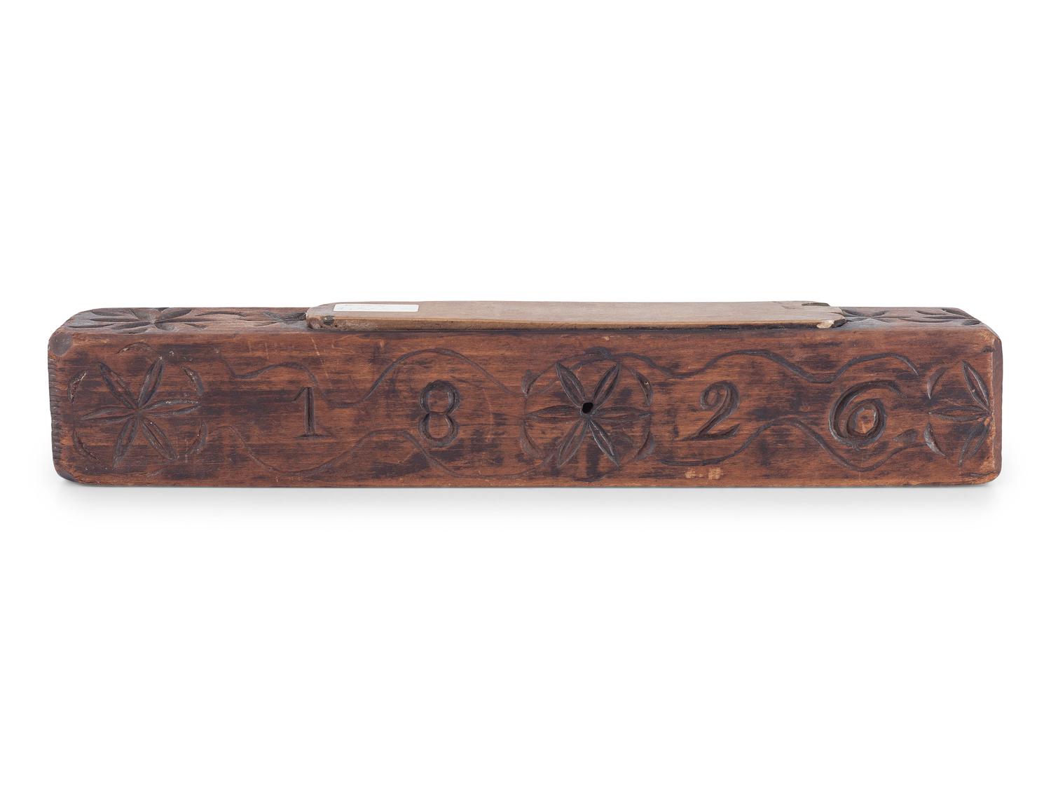 A Carved Wooden Folk Art Knife Sharpener