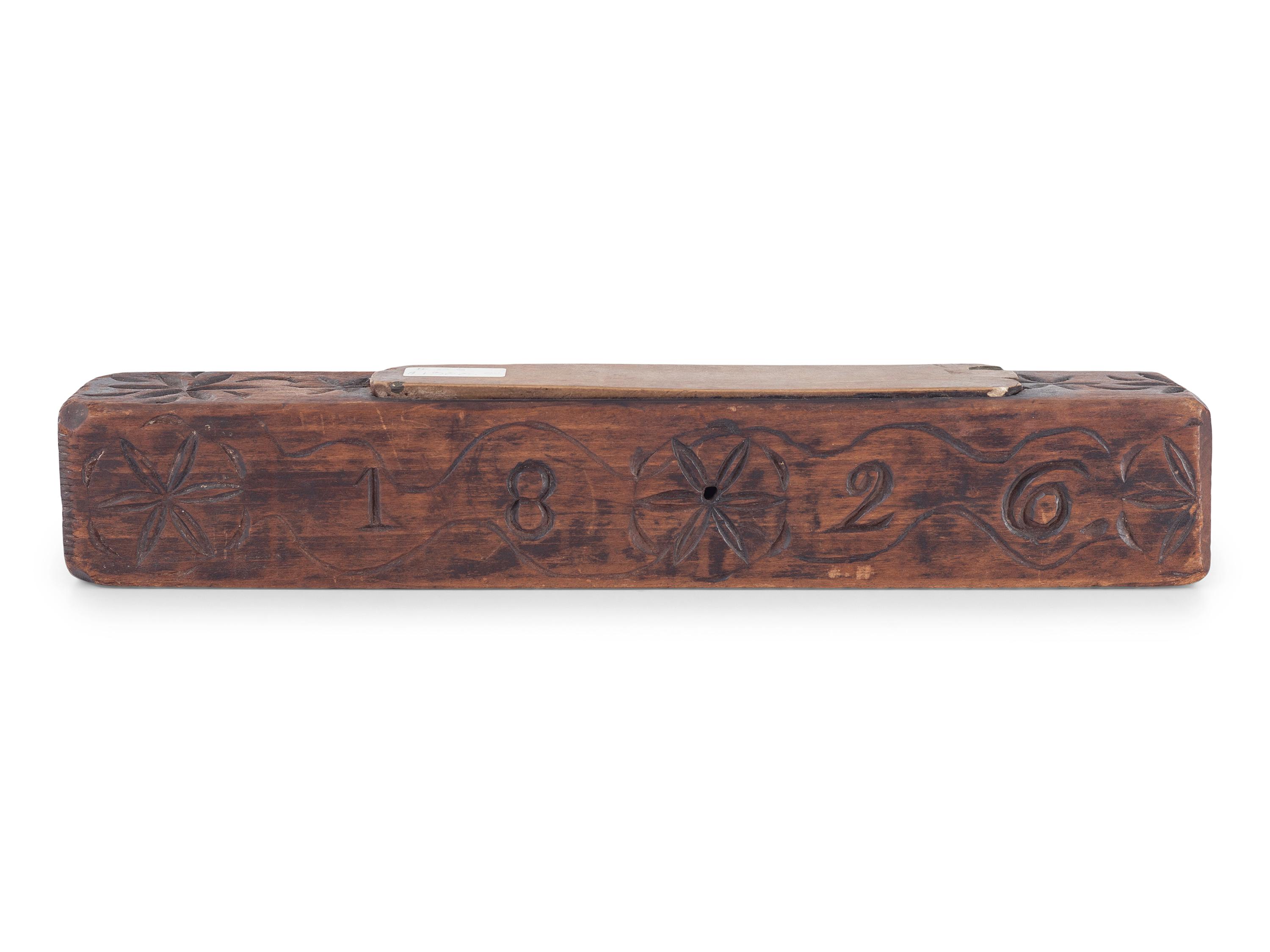 A Carved Wooden Folk Art Knife Sharpener