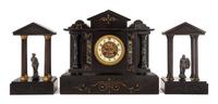A Continental Cast Metal and Slate Clock Garniture