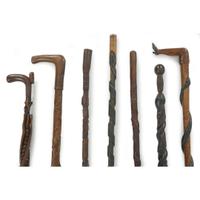 Group of seven carved and painted canes late 19th/early 20th century