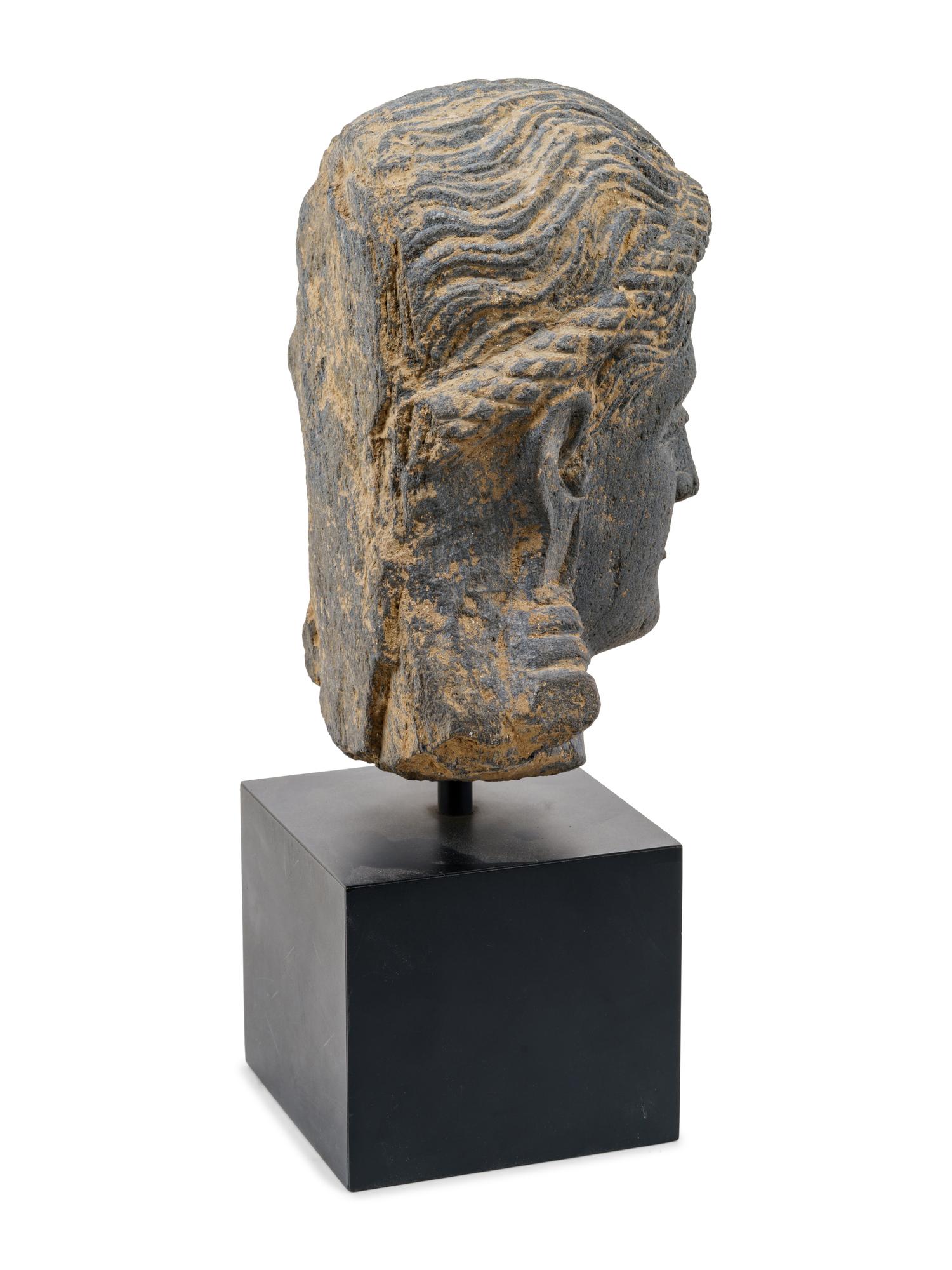 A Life Size Gandharan Grey Schist Head of the Goddess Hariti