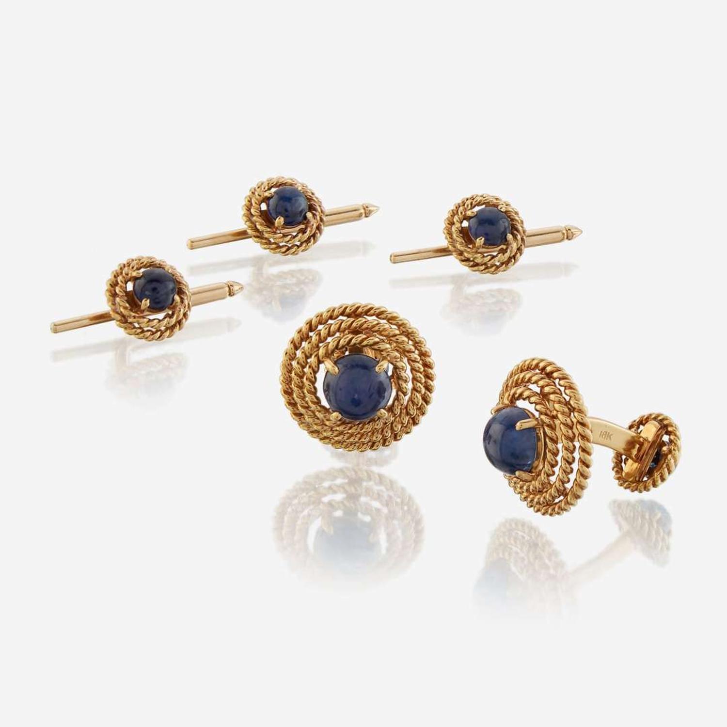 A gold and star sapphire dress suite