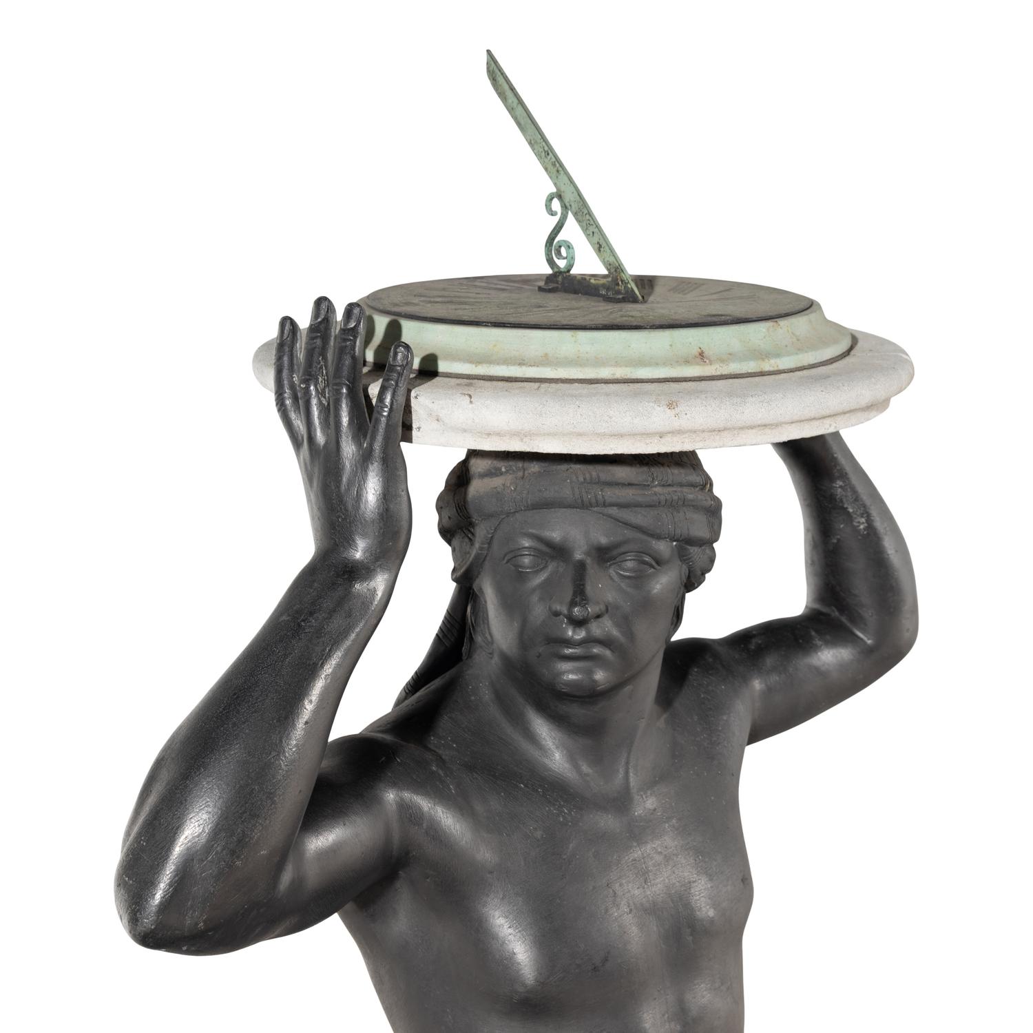 A Cast Lead Figural Sundial