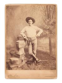 [WESTERN AMERICANA]. A group of 3 photographs of armed cowboys, incl. large format photograph taken by Mrs. ALBRIGHT, Albuquerque, NM. Ca 1880s.