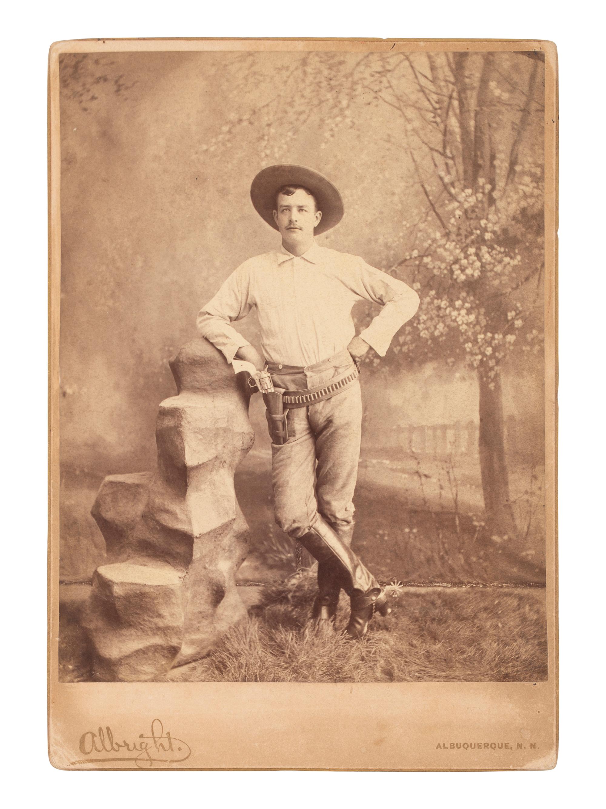 [WESTERN AMERICANA]. A group of 3 photographs of armed cowboys, incl. large format photograph taken by Mrs. ALBRIGHT, Albuquerque, NM. Ca 1880s.