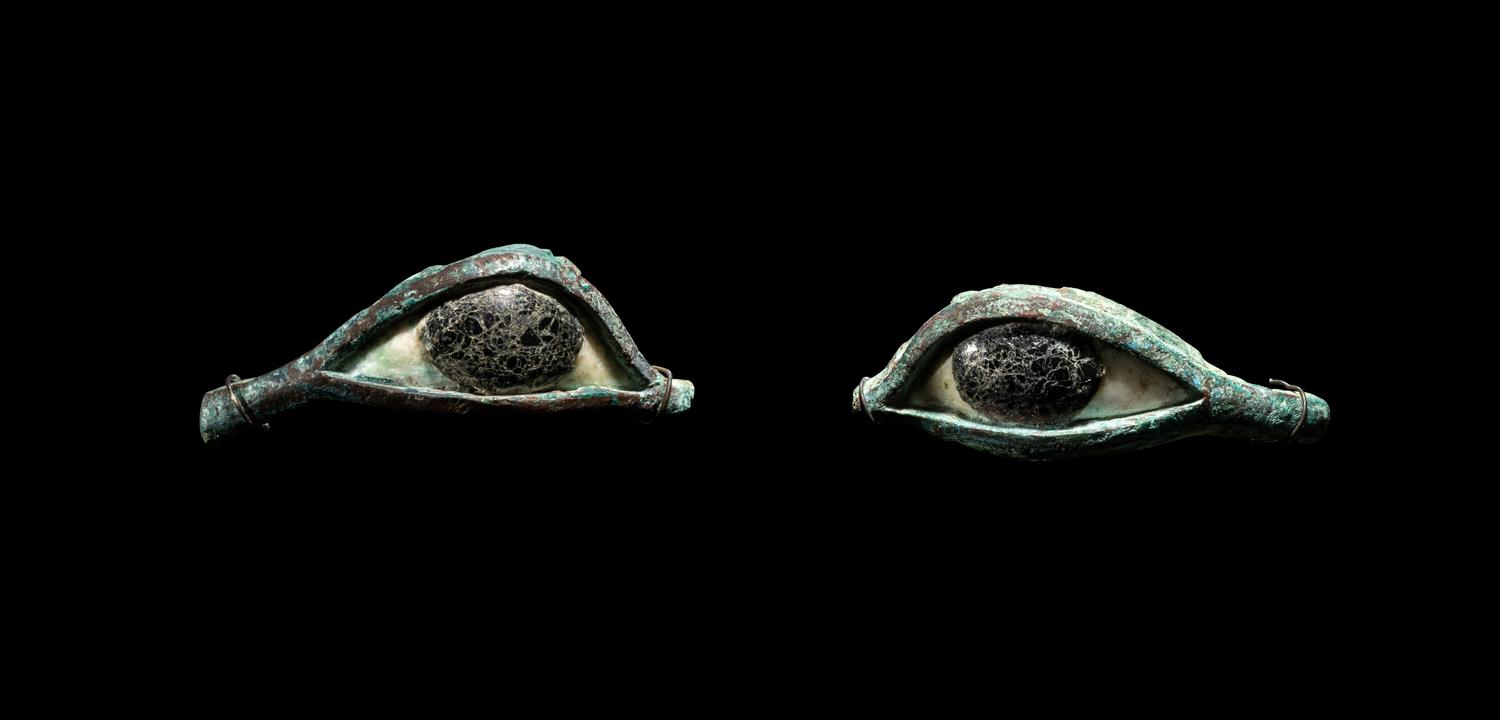 A Pair of Egyptian Bronze, Limestone, and Glass Eye Inlays