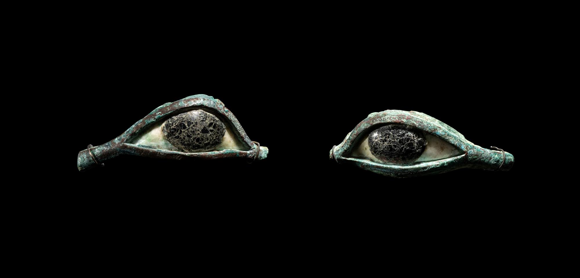 A Pair of Egyptian Bronze, Limestone, and Glass Eye Inlays