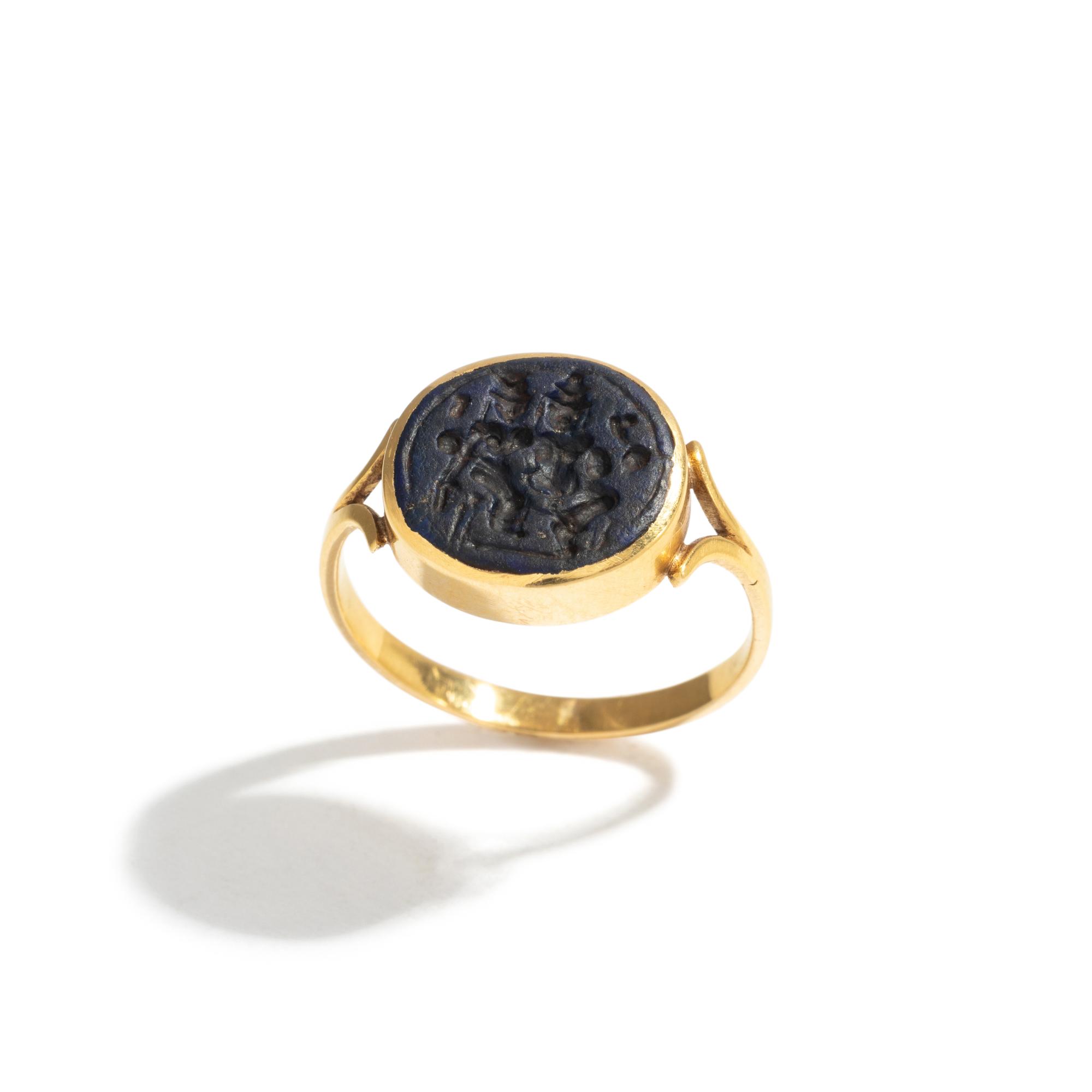 A Persian Blue Glass Intaglio with Two Figures — Set in a gold ring