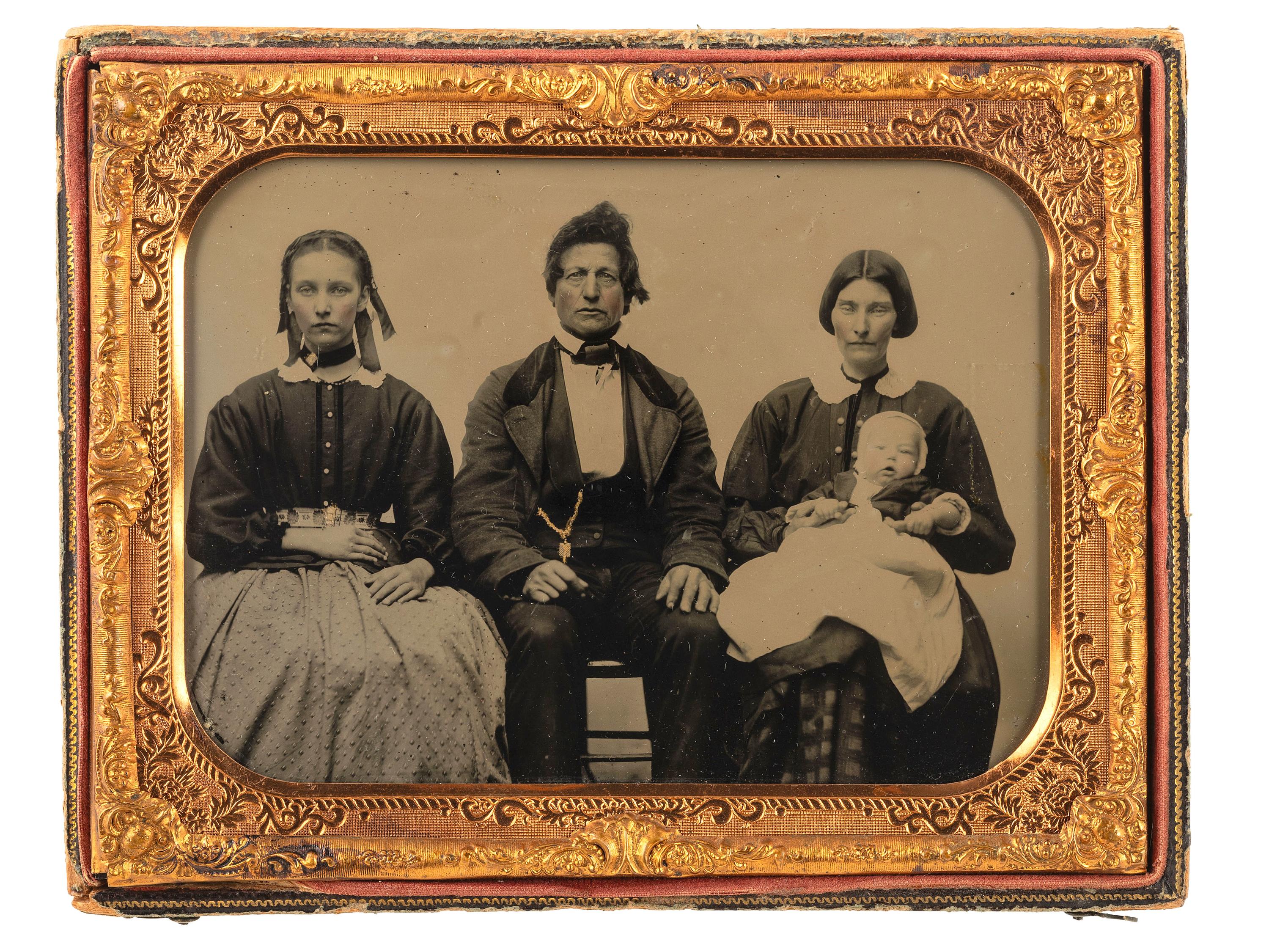 [EARLY PHOTOGRAPHY]. Half plate ambrotype of a family of four, acquired from Fort Smith, Arkansas.
