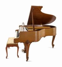 A Steinway & Sons Walnut Baby Grand Piano