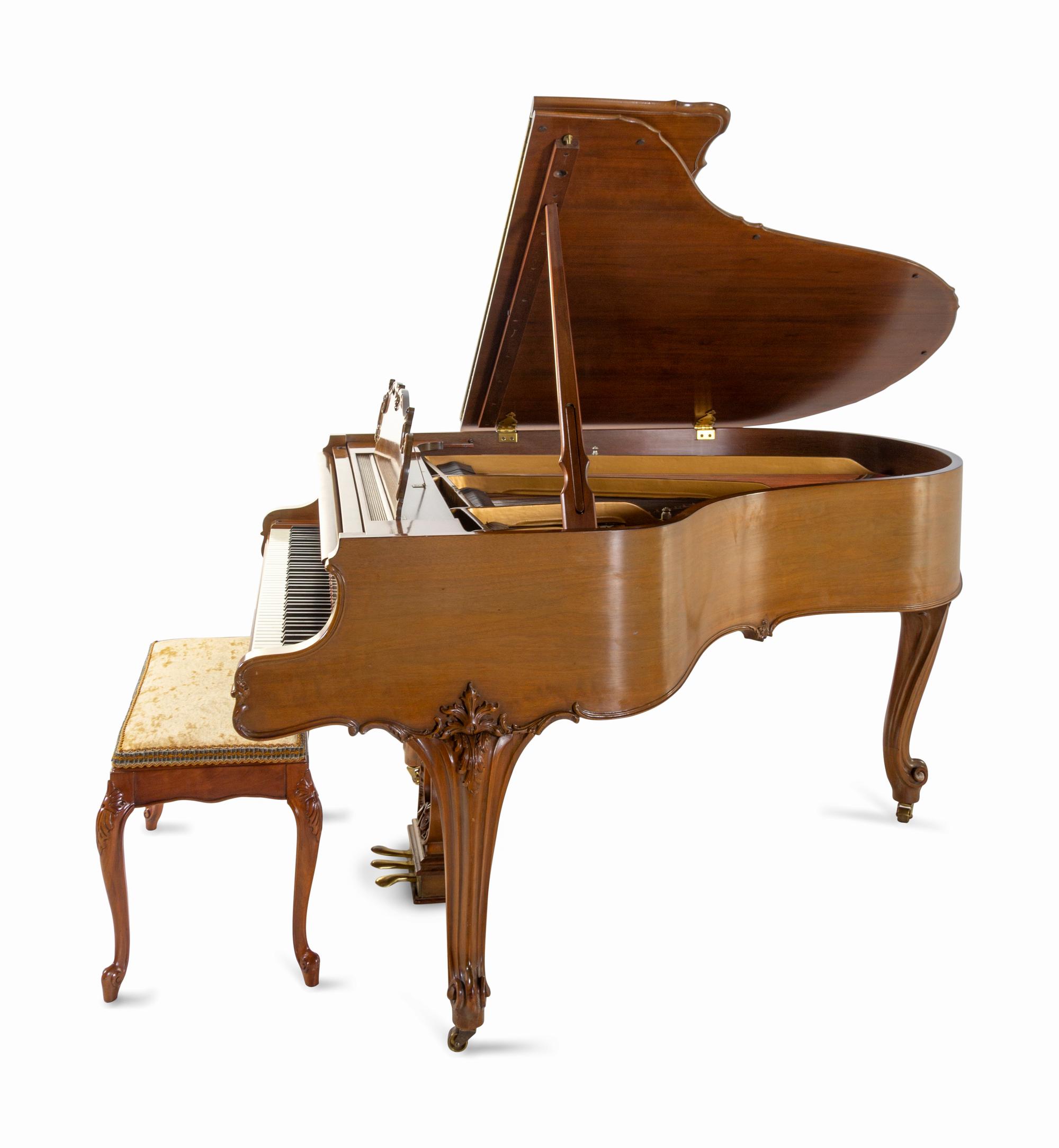 A Steinway & Sons Walnut Baby Grand Piano