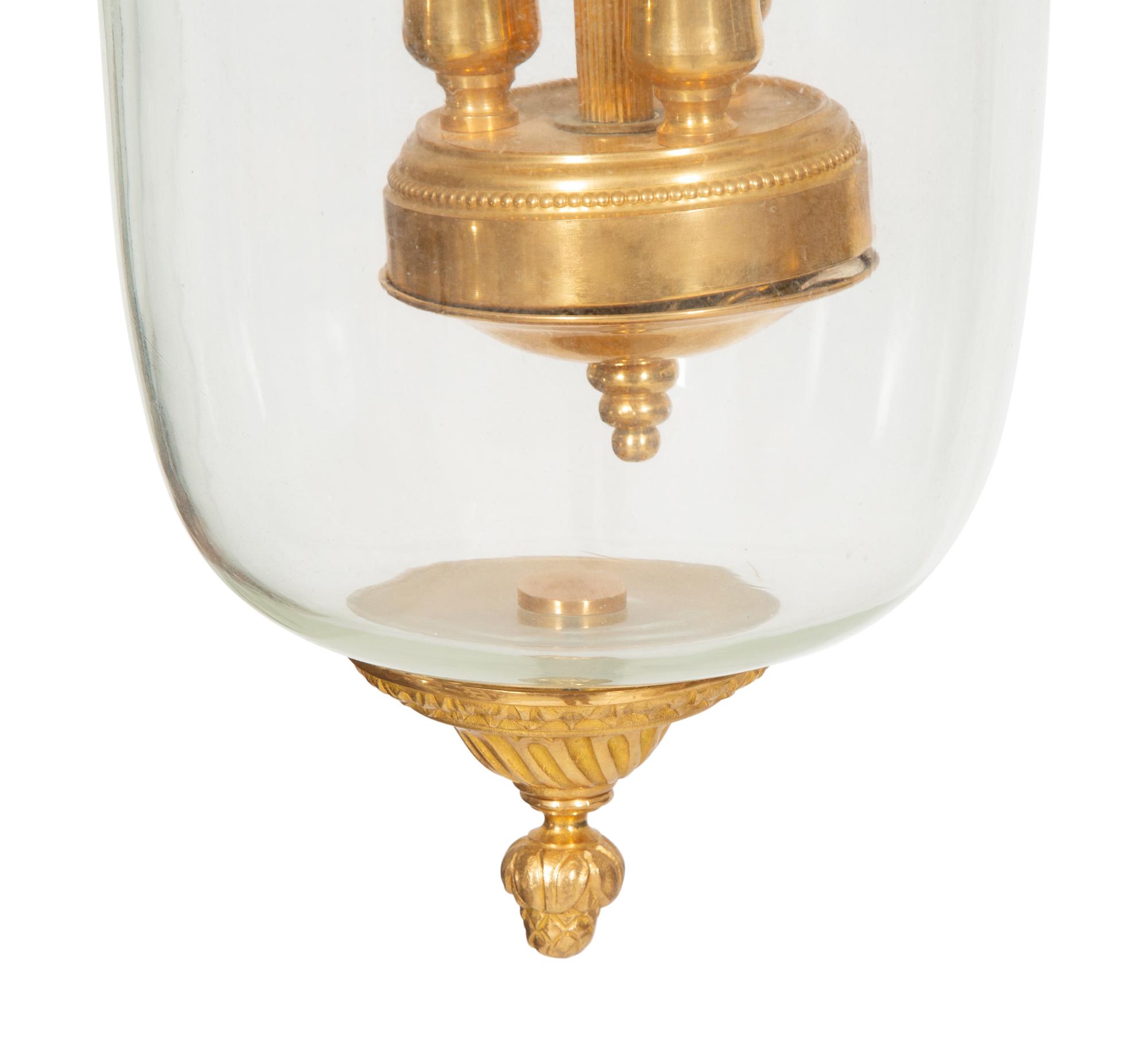 A Pair of French Gilt Metal and Glass Lanterns