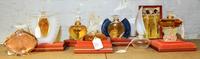 A Group of Eight Lalique Glass Perfume Bottles. Height of tallest 5 inches.