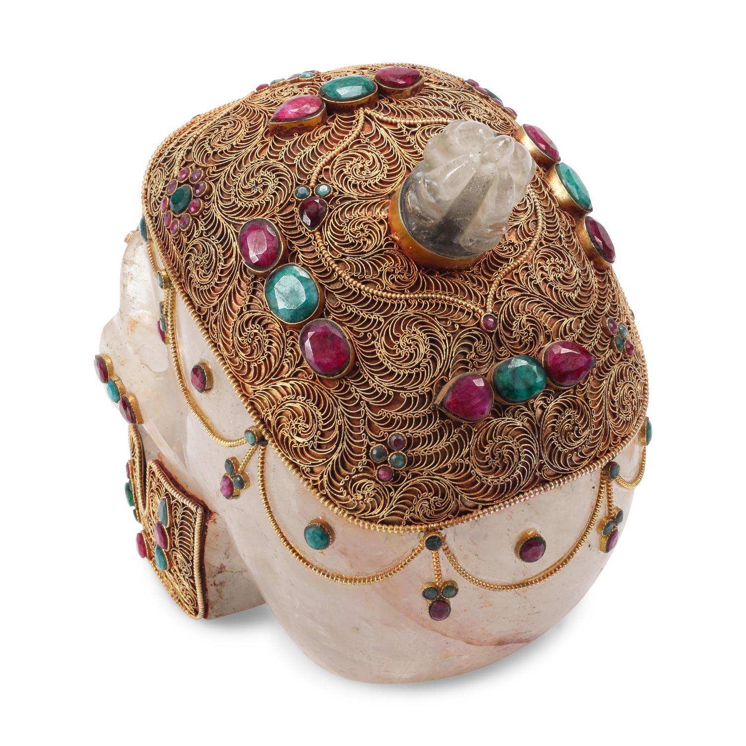 An Emerald, Ruby and Silver Filigree Mounted Rock Crystal Skull