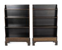 A Pair of Regency Style Ebonized and Gilt Waterfall Book Shelves — 19TH/20TH CENTURY