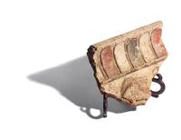 An Etruscan Painted Terracotta Relief Fragment