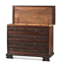 A Baroque Highly Carved Walnut Commode