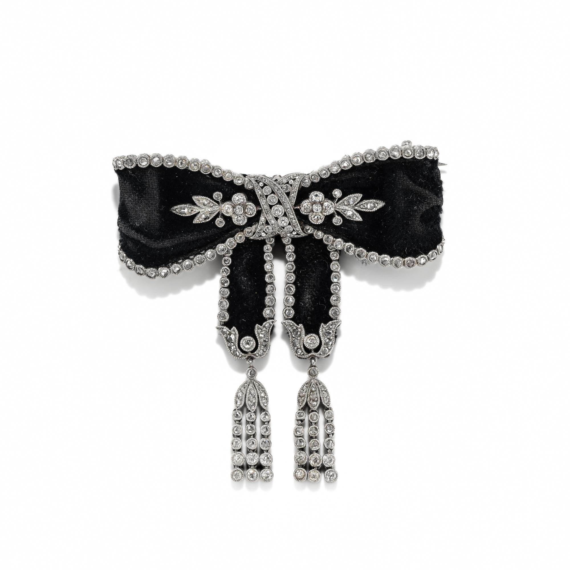 ART DECO, BLACK RIBBON, DIAMOND, AND PLATINUM BOW BROOCH