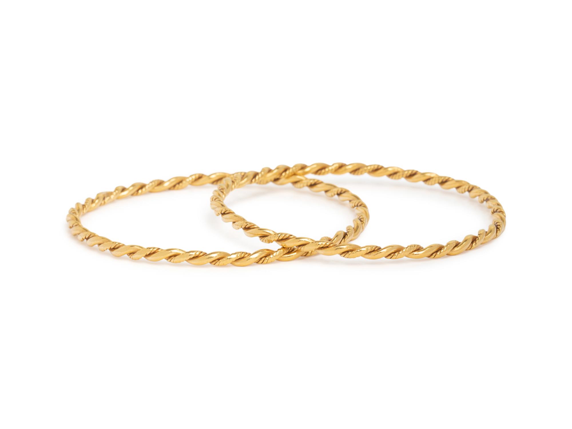 PAIR OF HIGH KARAT GOLD BANGLE BRACELETS