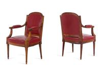 A Pair of Louis XVI Style Walnut Fauteuils