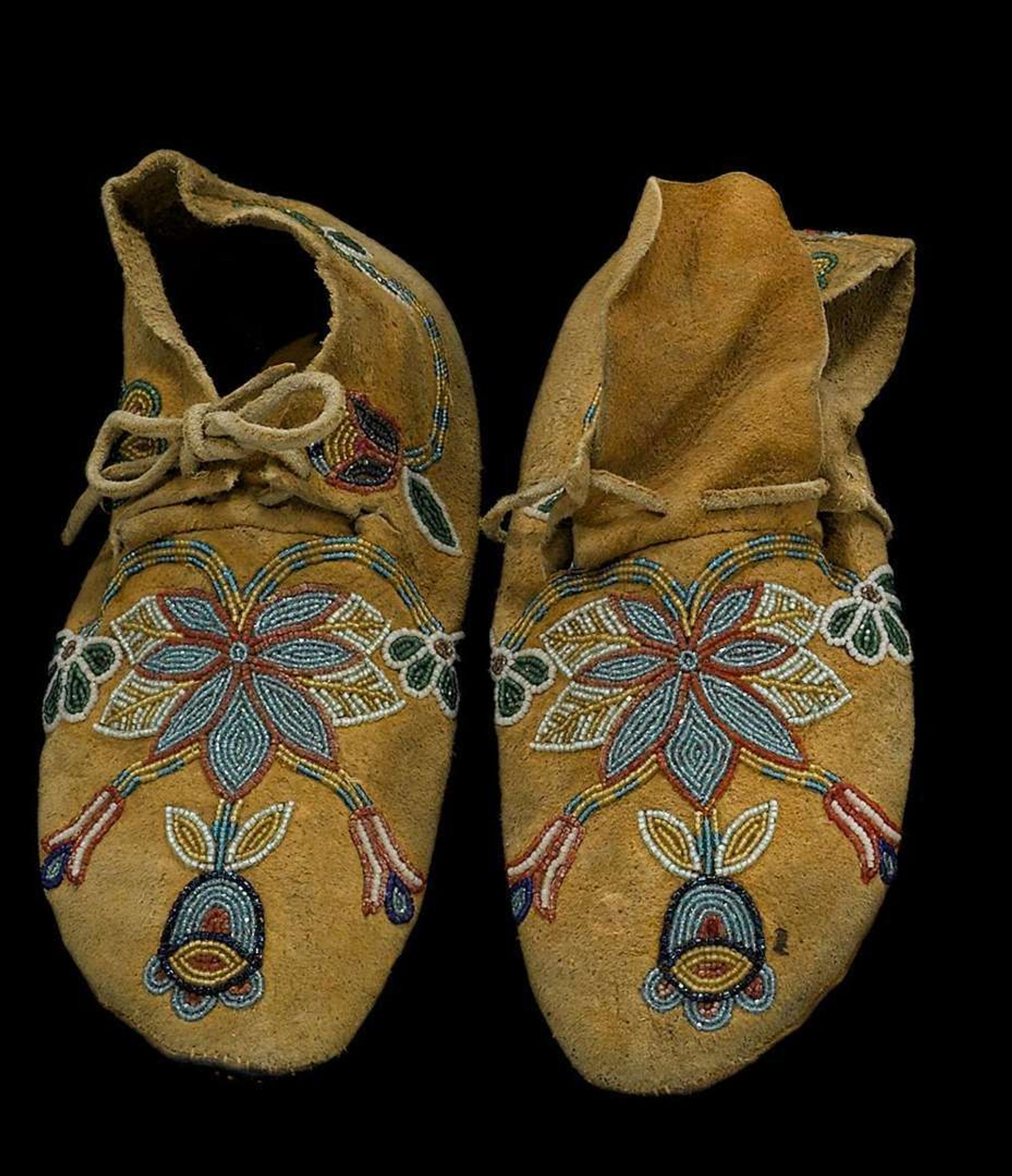 Pair of Crow beaded hide moccasins montana, first half 20th century