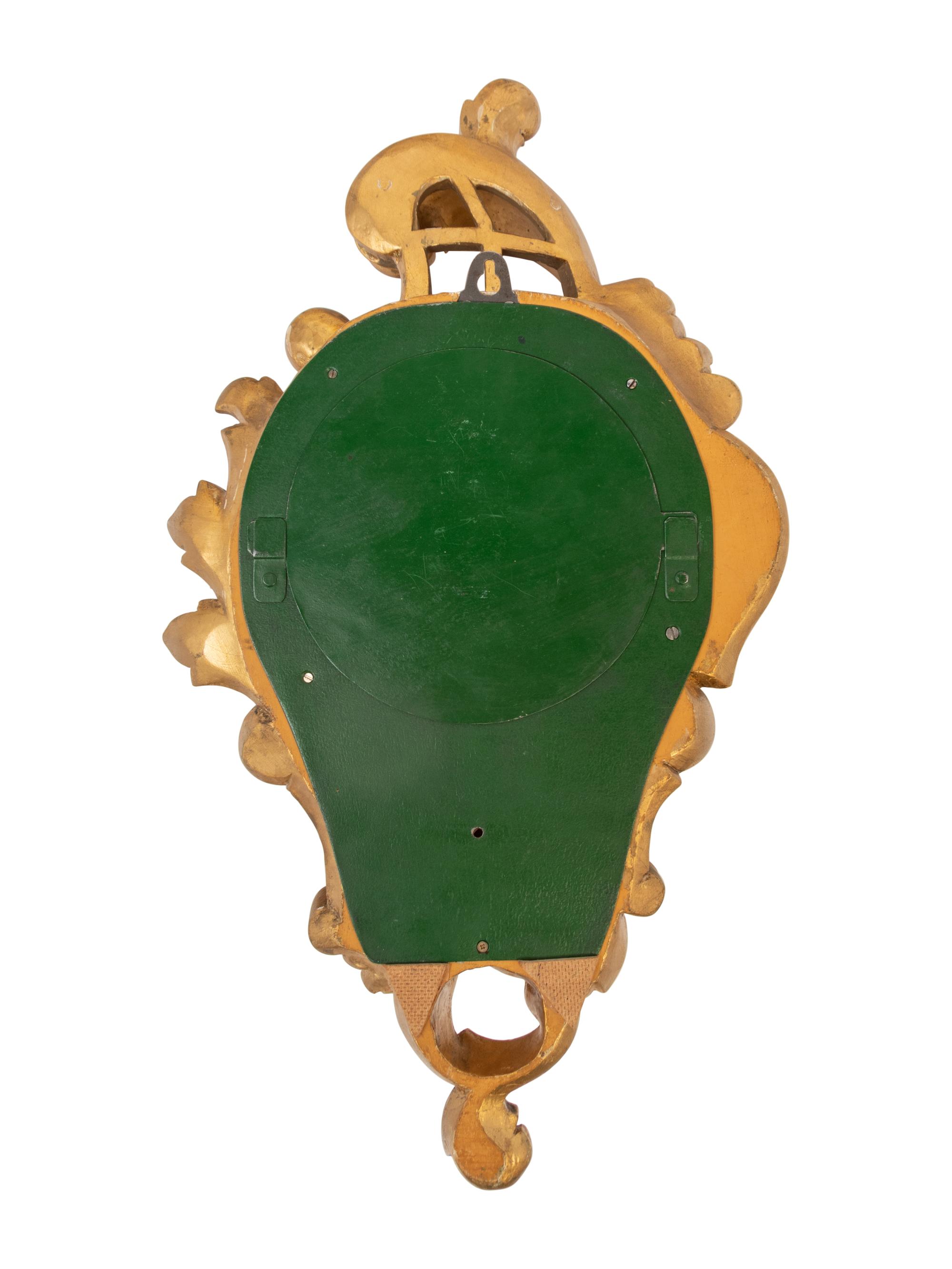 A Rococo Style Giltwood Cartel Clock