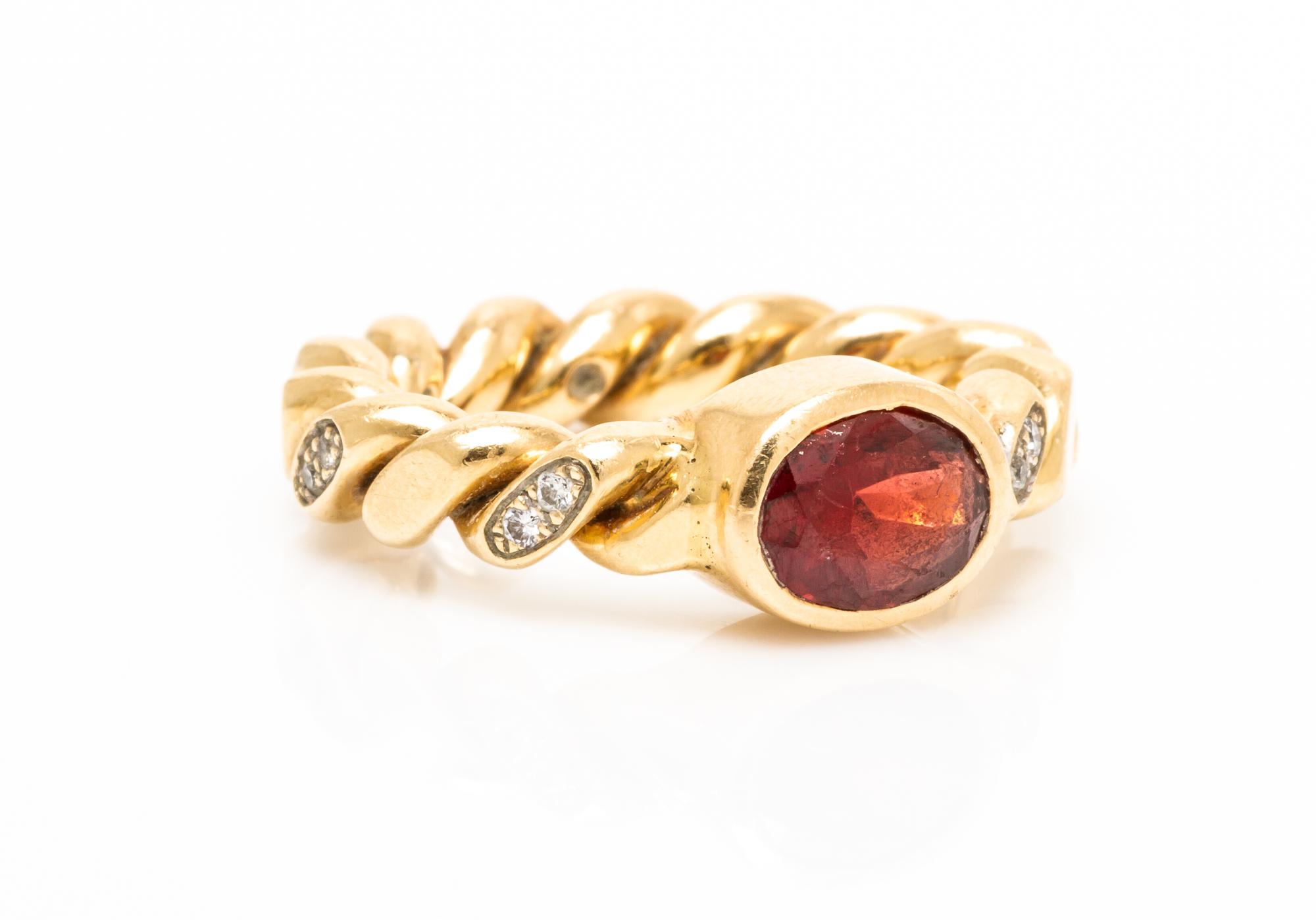 A 14 Karat Yellow Gold, Garnet and Diamond Ring, M&J Savitt, 6.00 dwts.