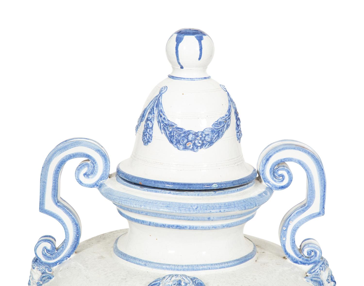 A Pair of Italian Blue and White Glazed Ceramic Covered Urns