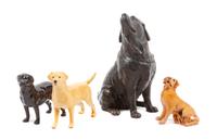 A Group of Four Labrador Retriever Figures Height of tallest 10 1/2 inches.
