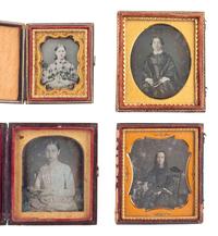 [EARLY PHOTOGRAPHY]. 12 daguerreotype portraits of female subjects holding cased images, including: