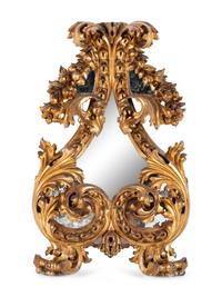 A Florentine Rococo Revival Carved Giltwood Mirror