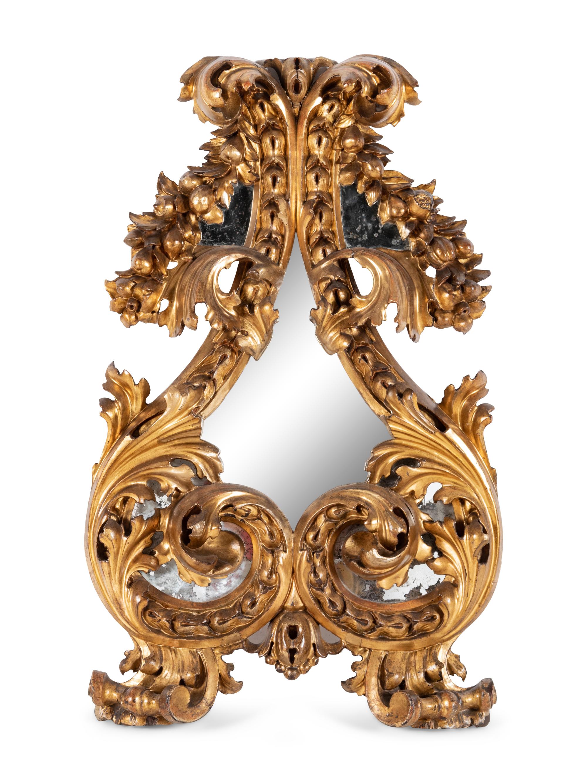 A Florentine Rococo Revival Carved Giltwood Mirror